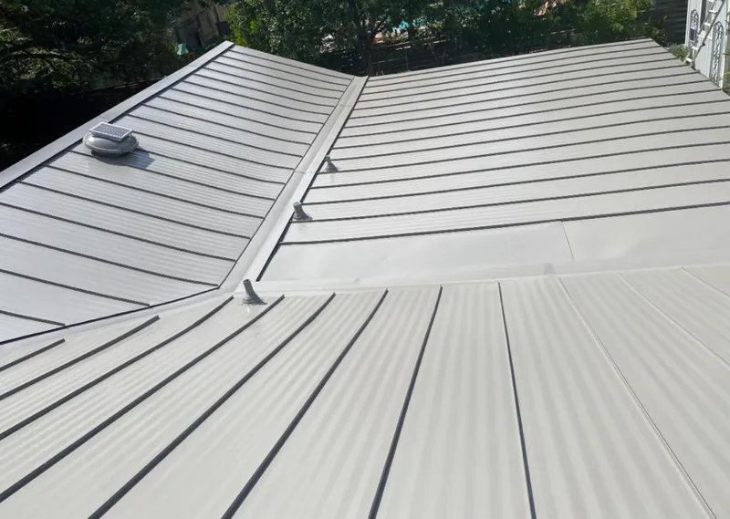 Solar attic fan installed on a metal roof for Roof Ventilation in Santa Maria